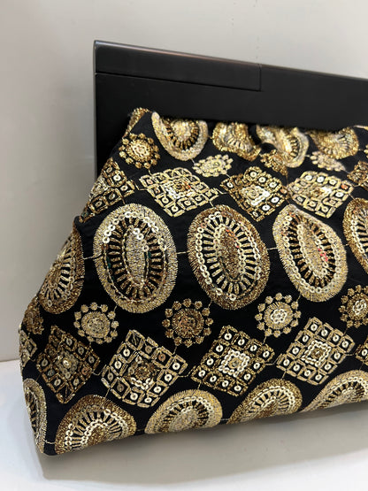 Midnight gold clutch