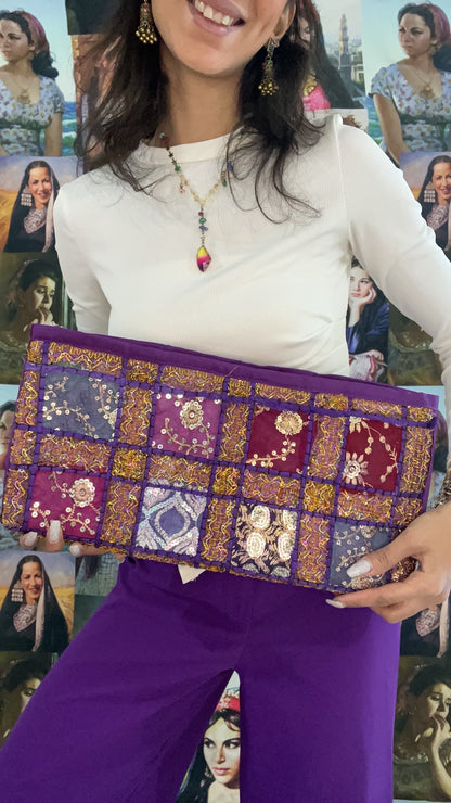 purple embroidered clutch