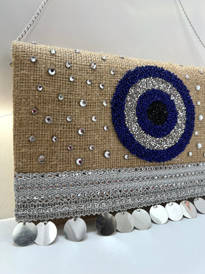 Evil eye clutch